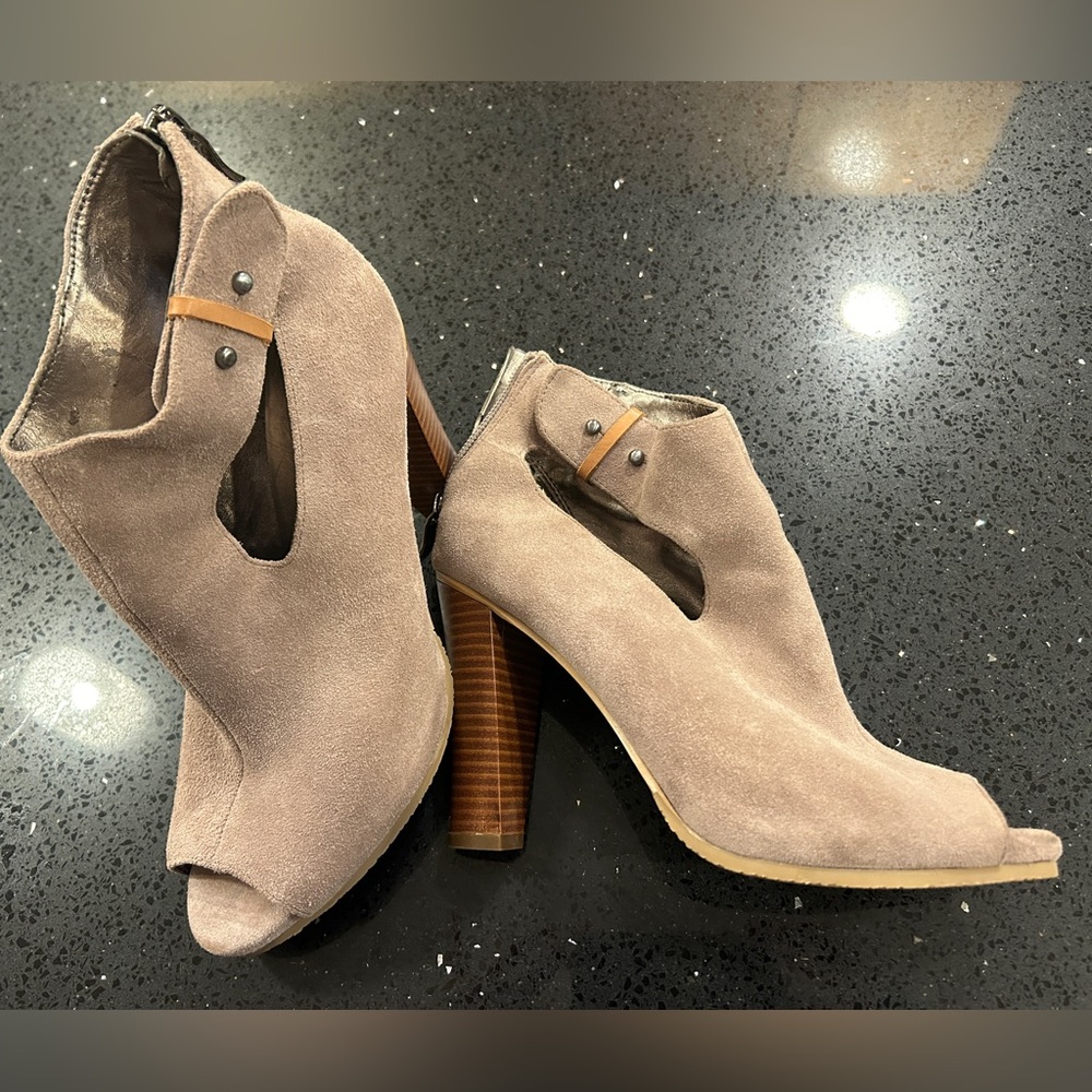 Taupe peep toe suede booties.